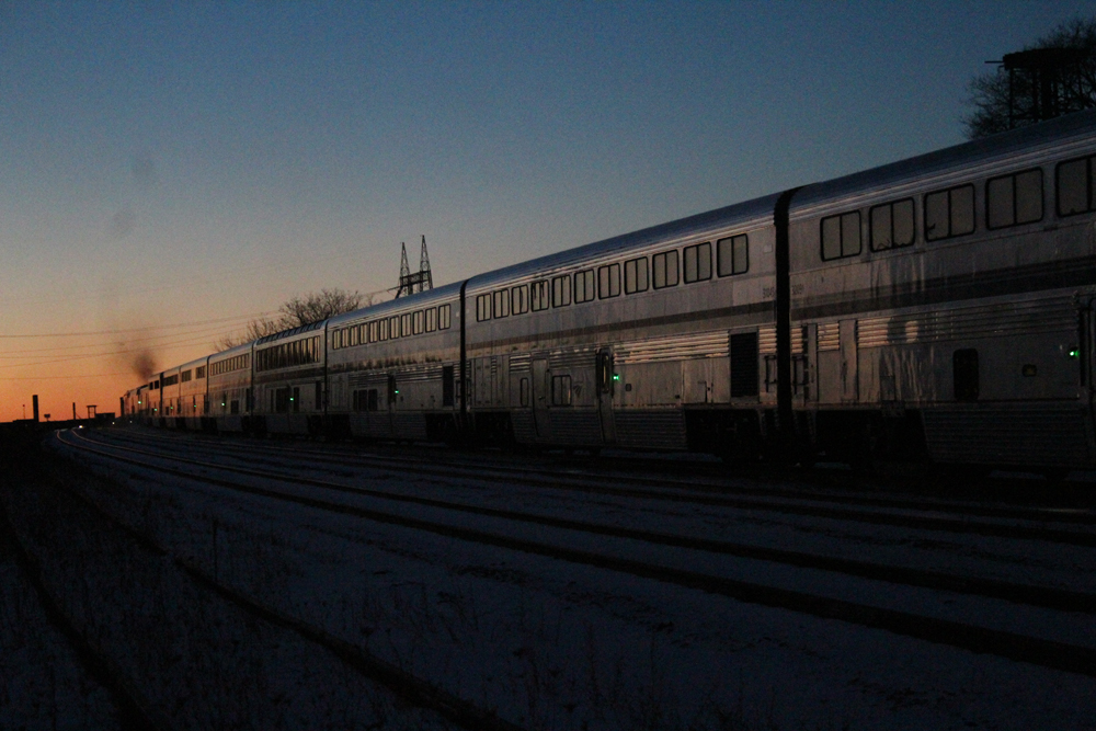 Passenger train at sunset. Amtrak cancellations mudslide snow