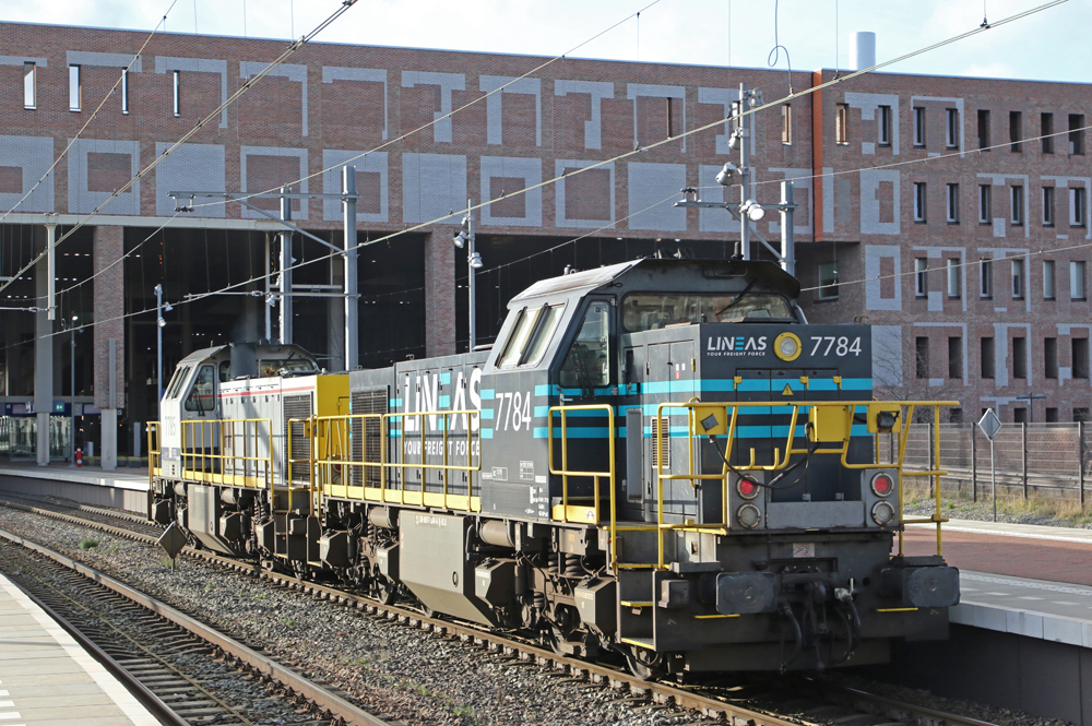Two switching locomotives outside shop building