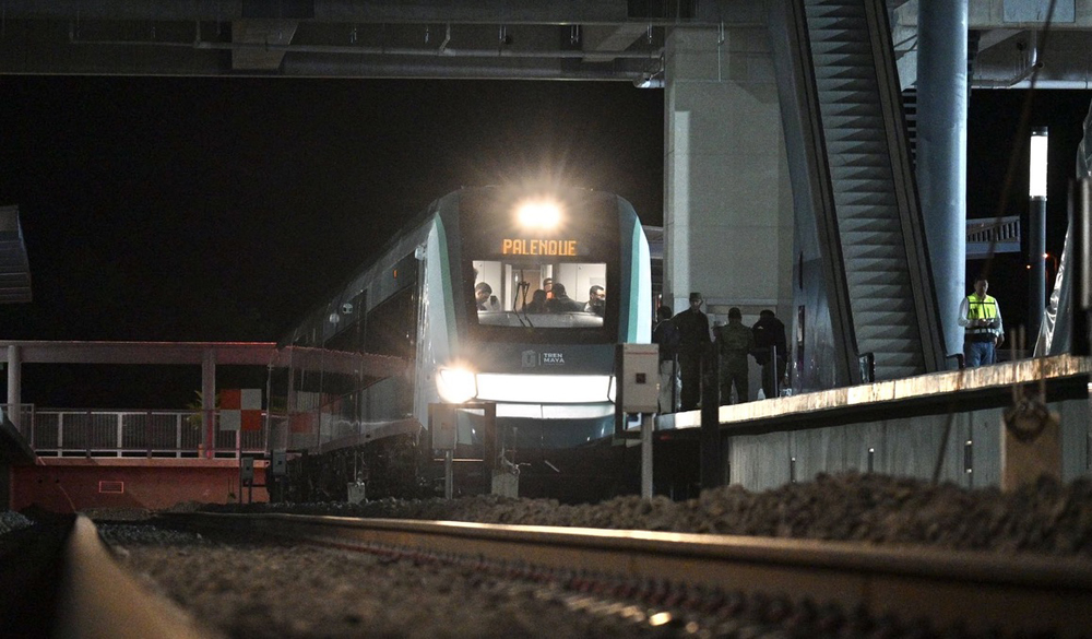 Pasenger train in shadows at station