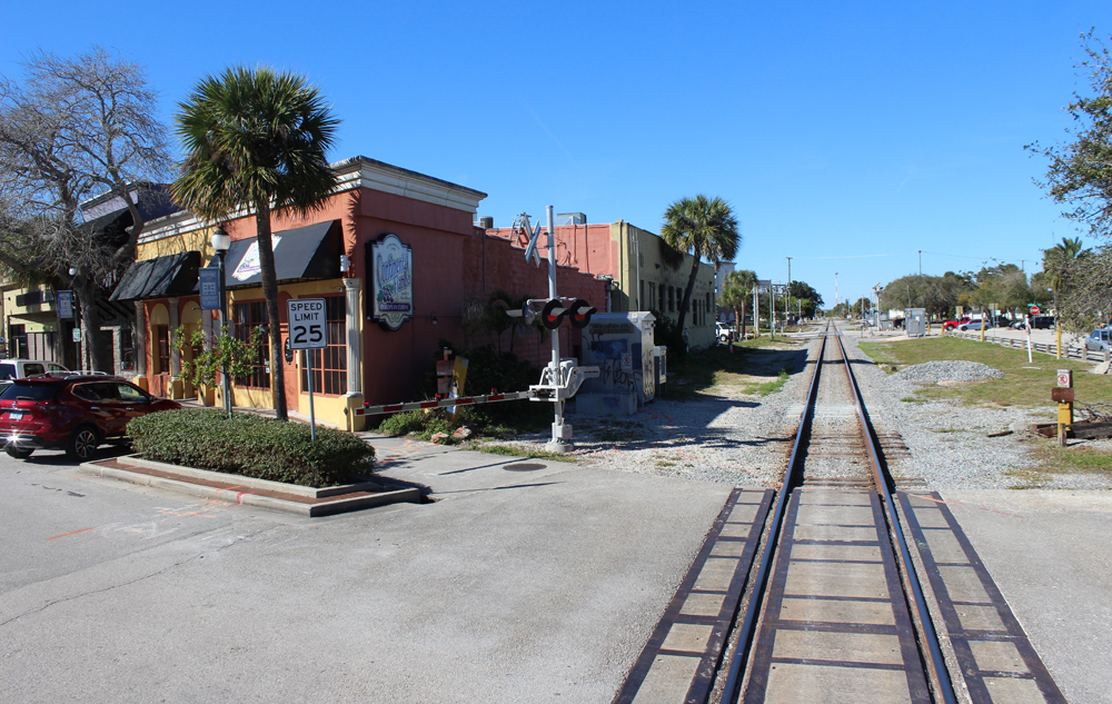 Grade crossing in downtown area as seen from onboard train