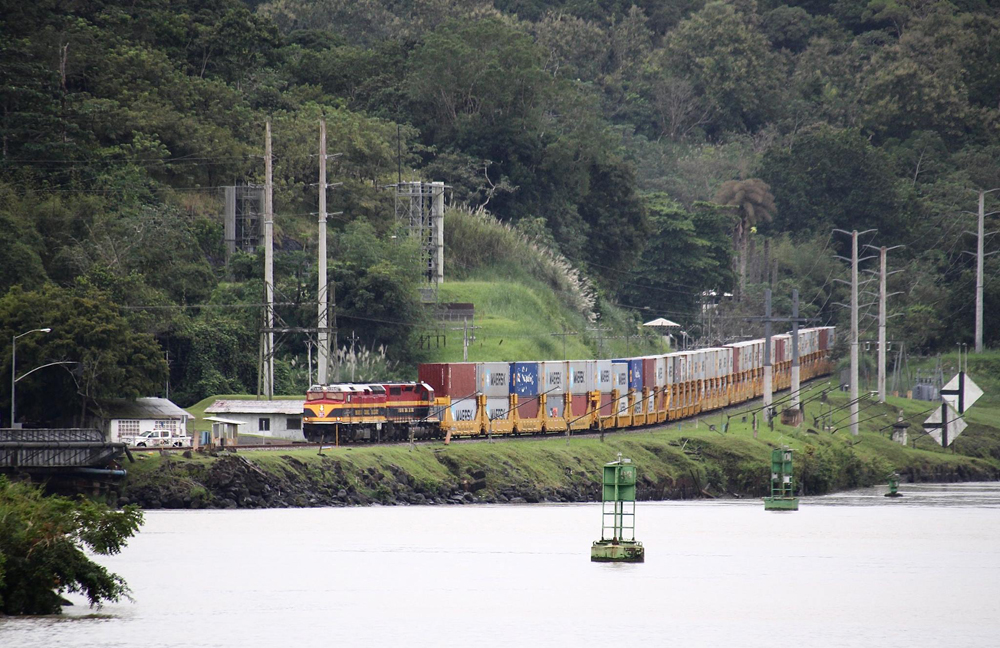 Container train next to body of water