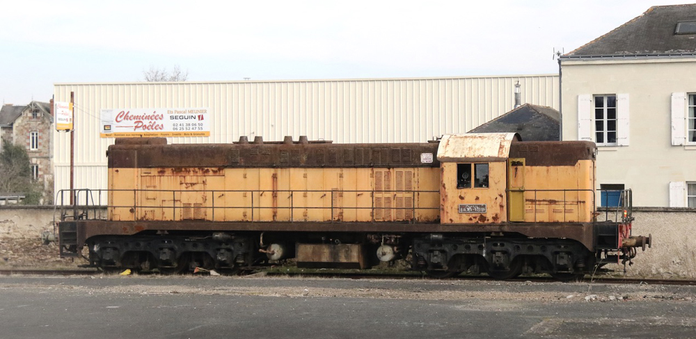 Predominantly yellow diesel locomotive with some visible rust