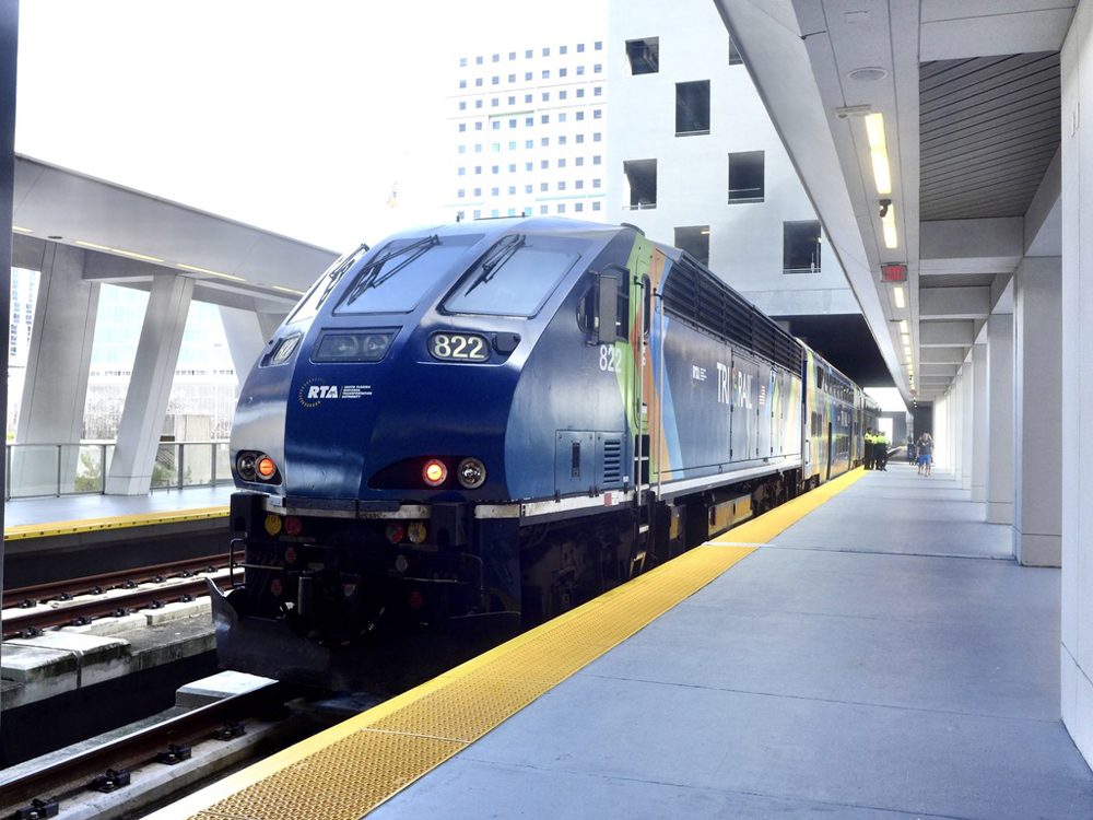 Train with blue locomotive at station