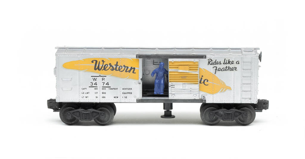 Silver and yellow toy boxcar