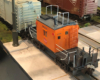black and orange caboose on model track