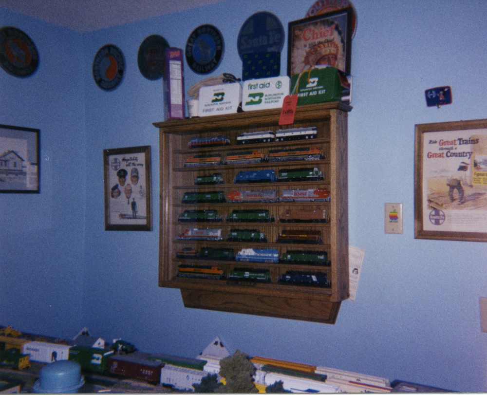 Color photo of locomotive display case and railroadiana.