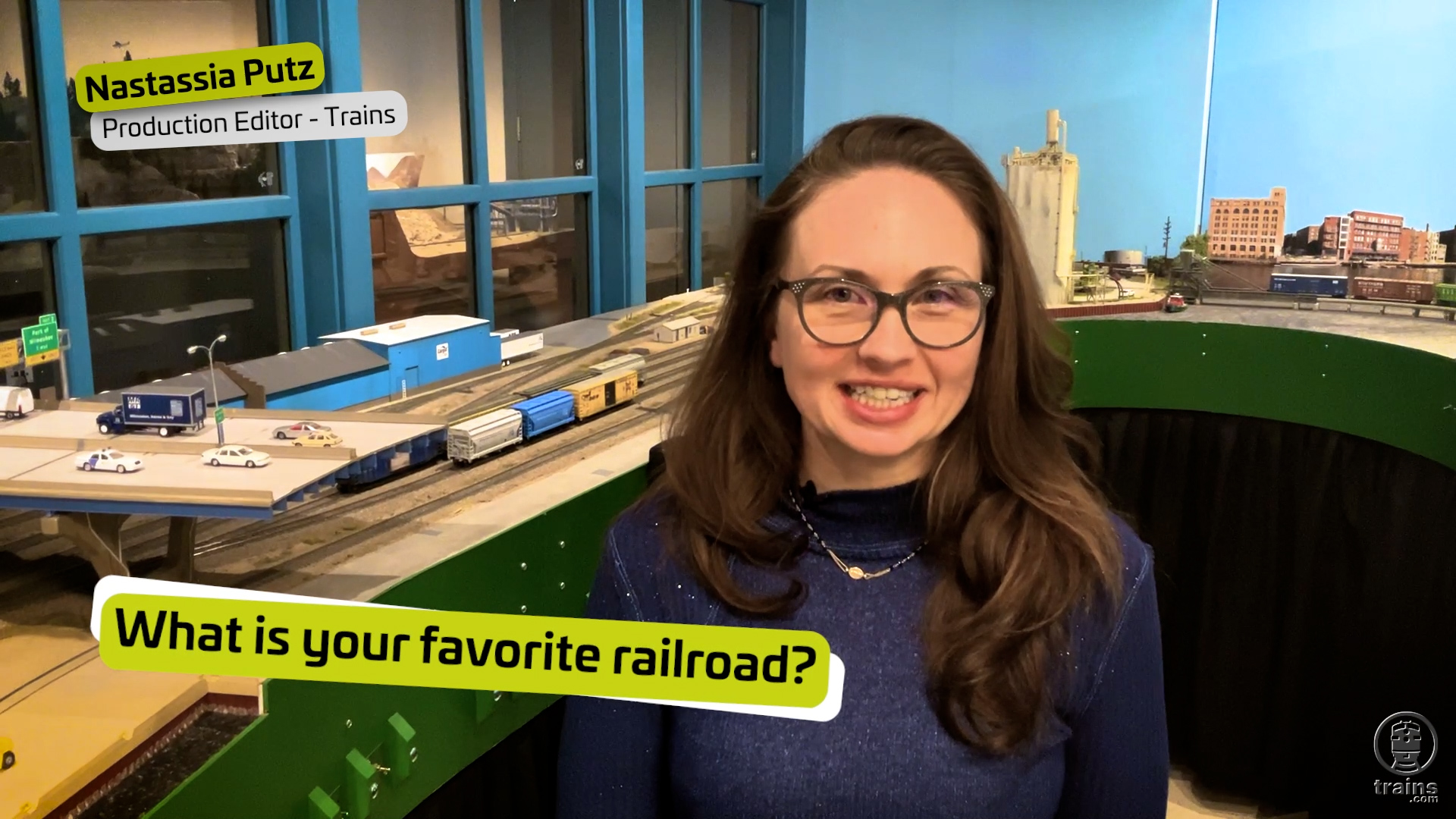 Interviewee in front of a model railroad.