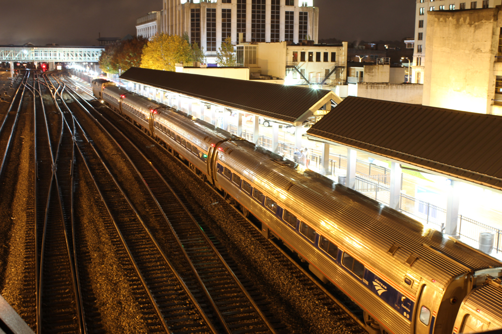 Passenger train at station at night.