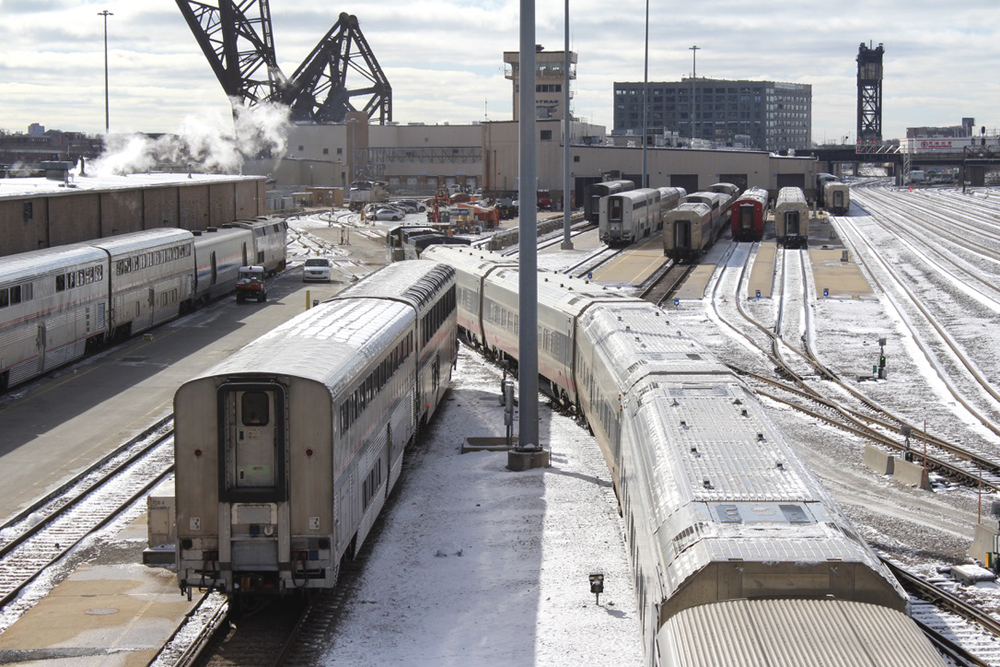 Passenger cars at yard with dusting of snow