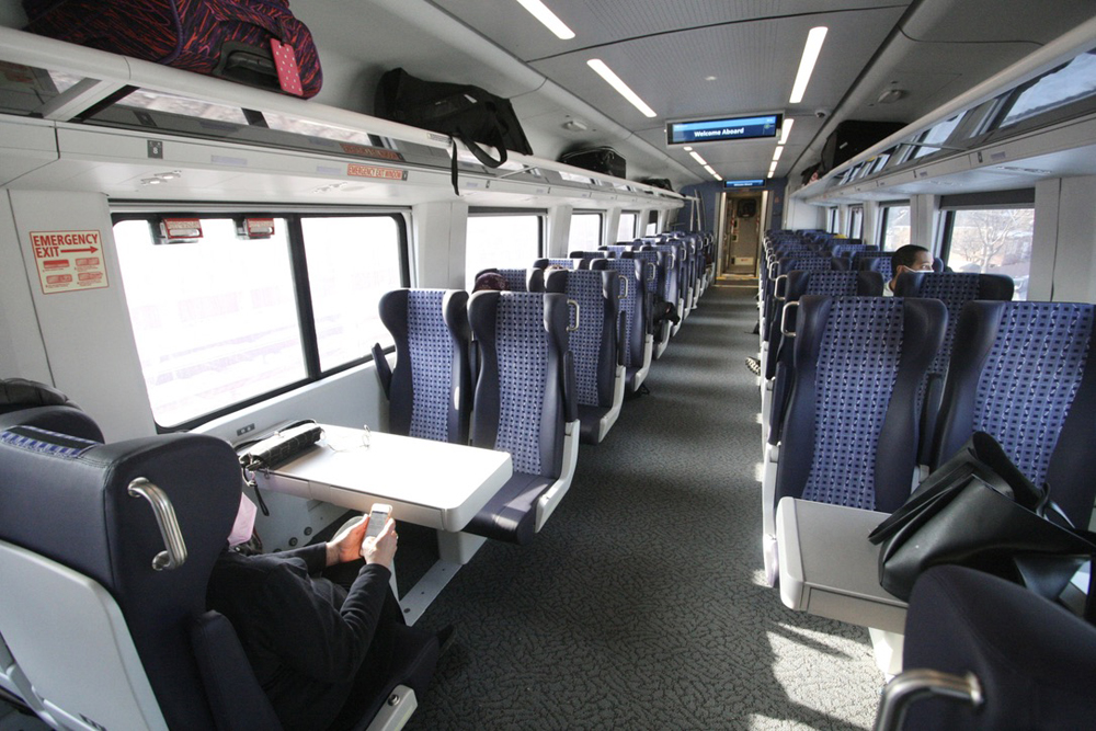 Interior of passenger car with seats facing toward the car center