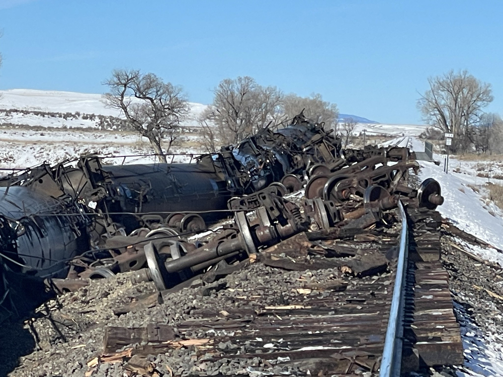 Torn up track and overturned tank cars at derailment site