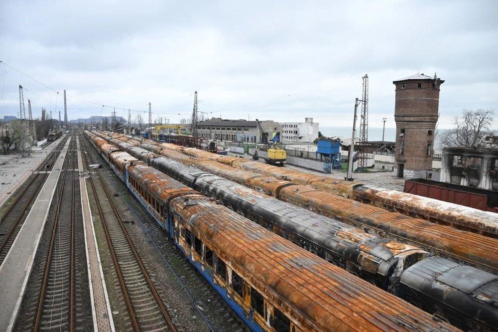 Fire-damaged passenger cars in yard