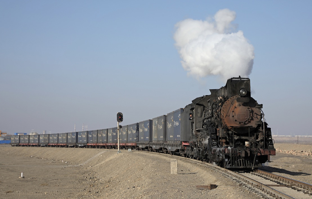 Steam locomotive pulling containers
