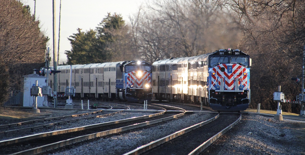 Two commuter trains meet on curve