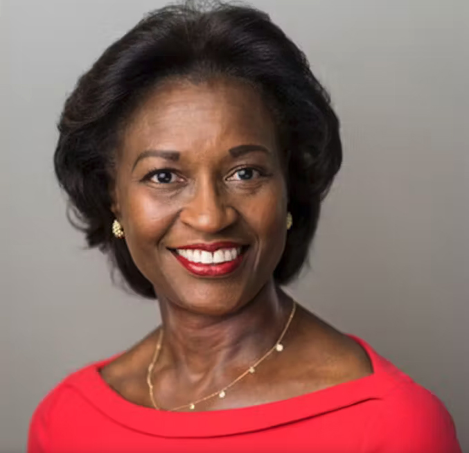 Woman with dark hair in red blouse