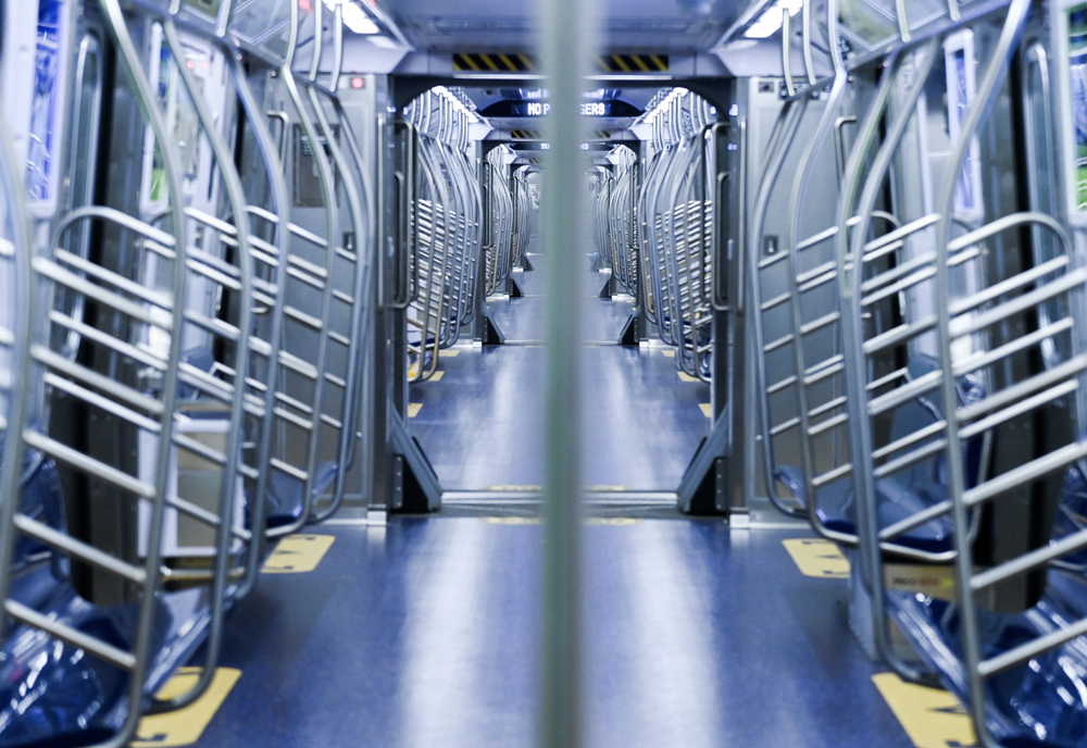 View along length of open-gangway subway train