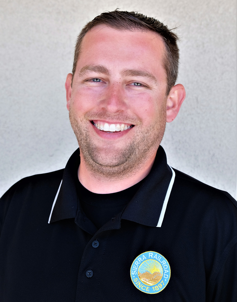Head shot of man in black shirt