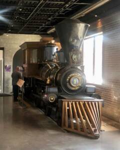 Small steam locomotive preserved inside building