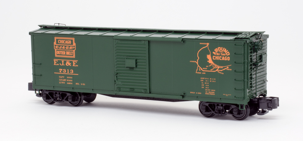 Color photo of S gauge boxcar painted green with orange graphics