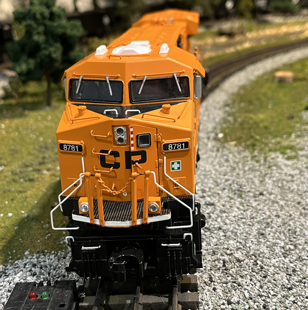 front of orange model train