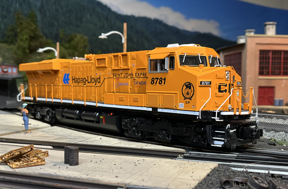 orange model train on layout
