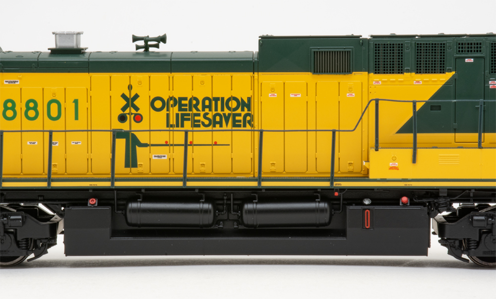 Color photo showing fuel tank and long hood on diesel locomotive.