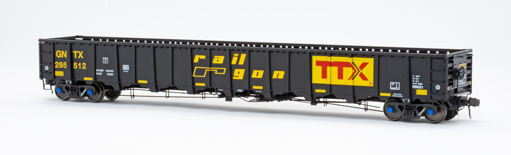 Color photo of HO scale gondola painted black with yellow, red, and white graphics.