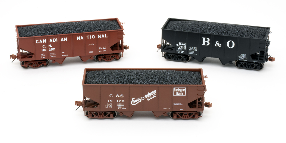 Color image of three HO scale hopper cars.