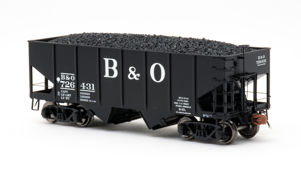 Color photo of HO scale freight car painted black with white graphics.