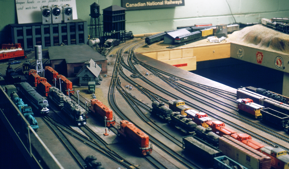 Color photo showing yard scene on model railroad.