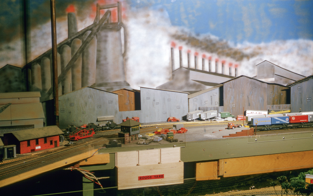 Color photo of heavy industrial scene on a model railroad.