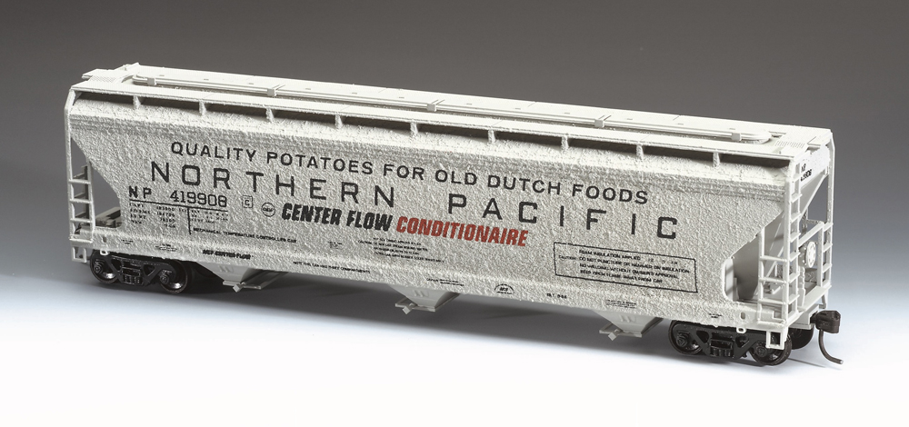 Color photo of HO scale freight car painted gray with black and red graphics.