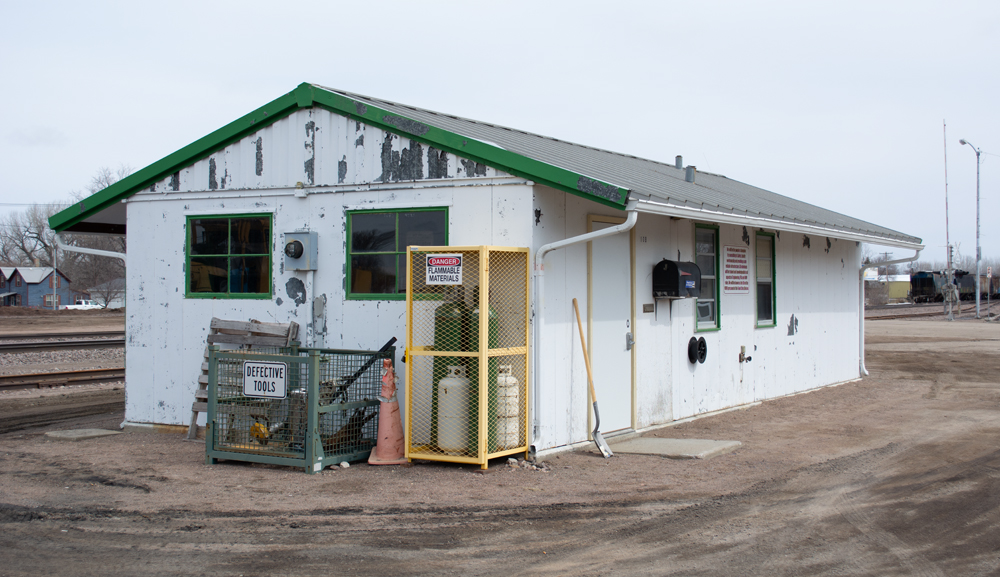 Color photo showing supplies next to yard office. 