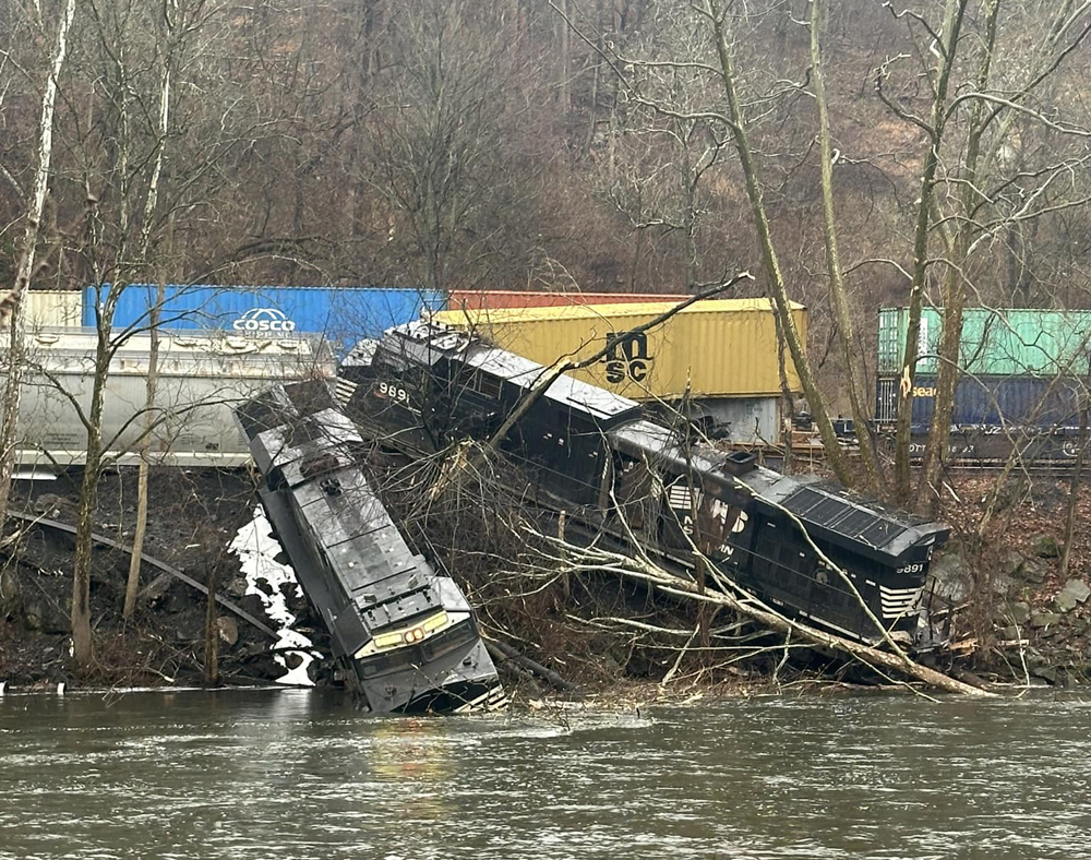 Locomotives on riverbank after derailment