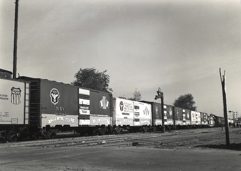 Black and white photo of a freight train decorated as the Friendship Train.
