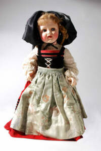 White, red, and black children's doll