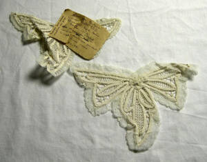 Lace butterflies on a white cloth background