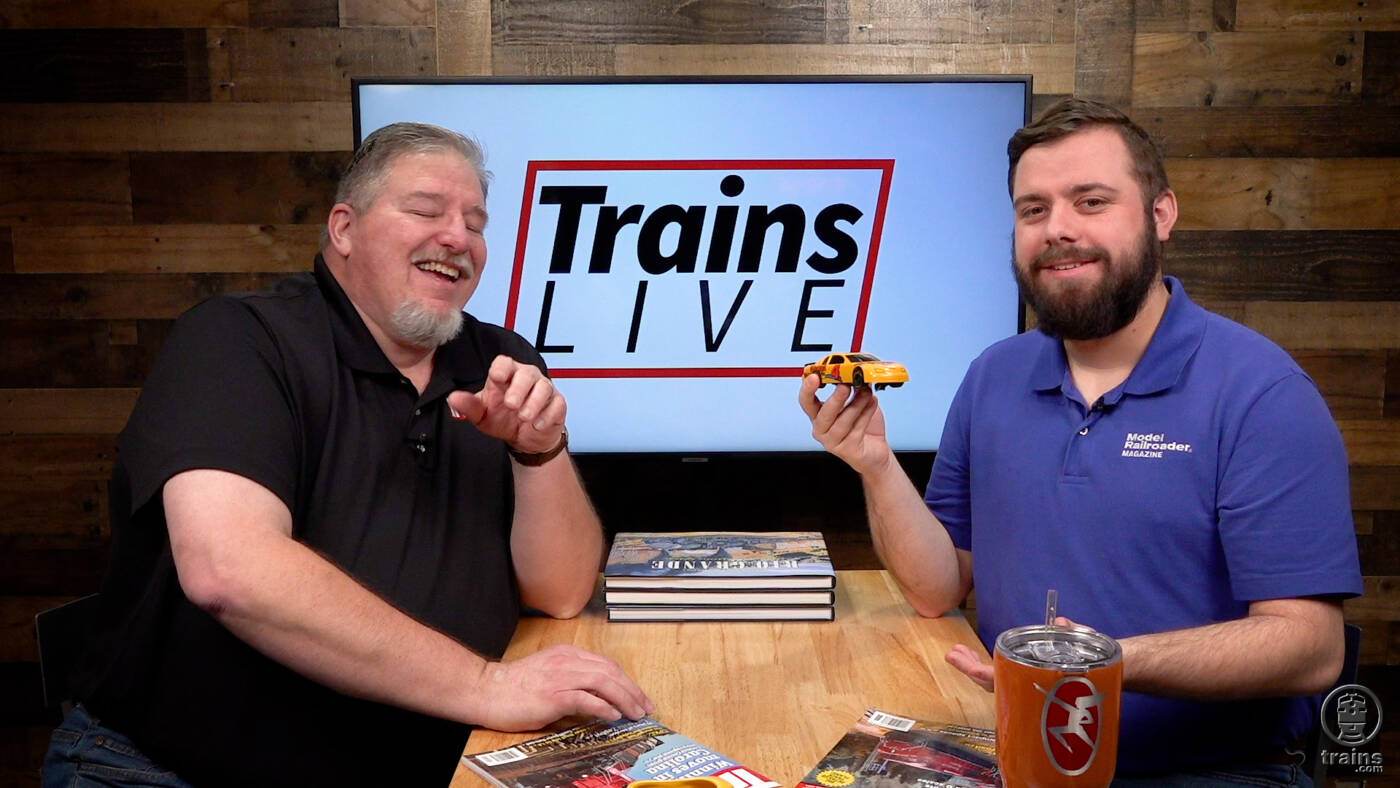 Two men talking on a TV interview set. Trains LIVE — The Mad City Model Railroad Show