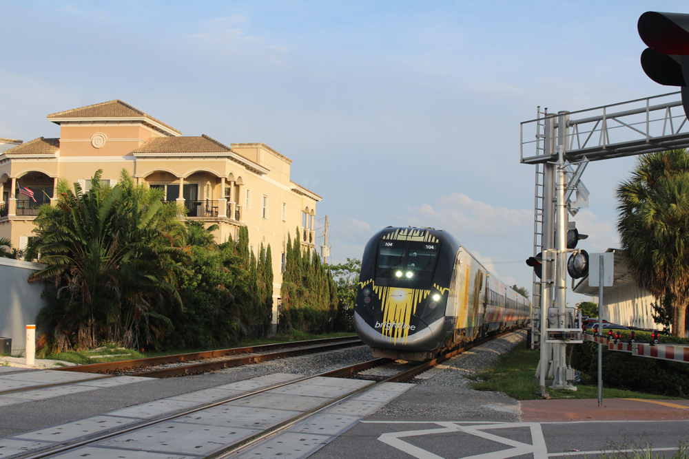 Passenger train at grade crossing