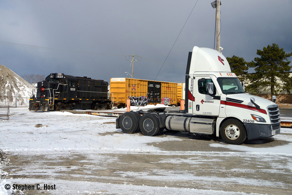 Black locomotive and boxcars