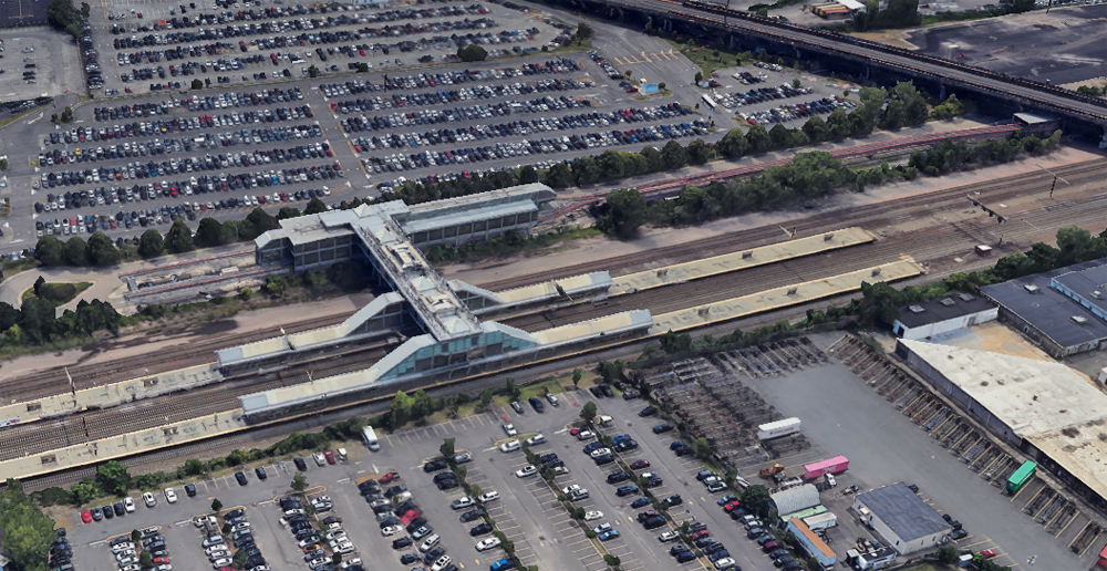 Aerial view of station straddling Northeast Corridor