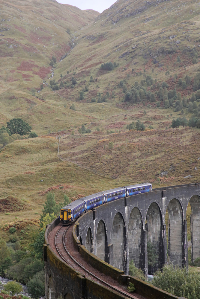 Diesel multiple-unit passenger train on curved viaduct