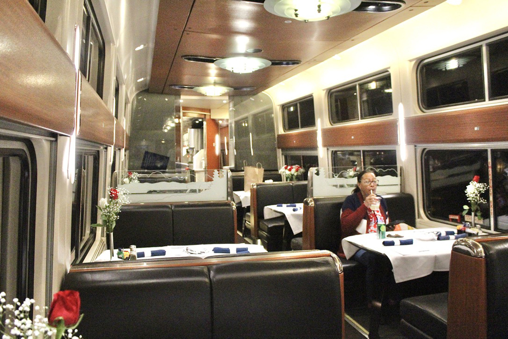 Amtrak dining car with one person dining at one table