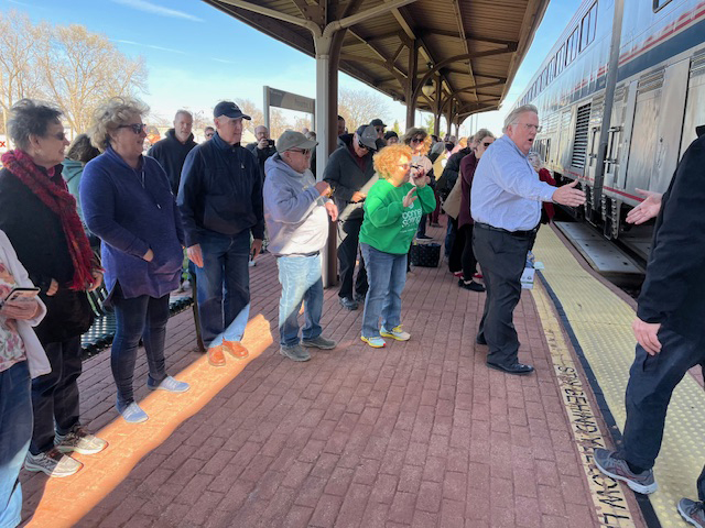 People on platform of train station