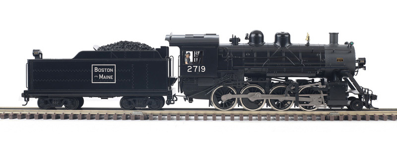 Color photo of O gauge steam locomotive painted black and graphite with white graphics.