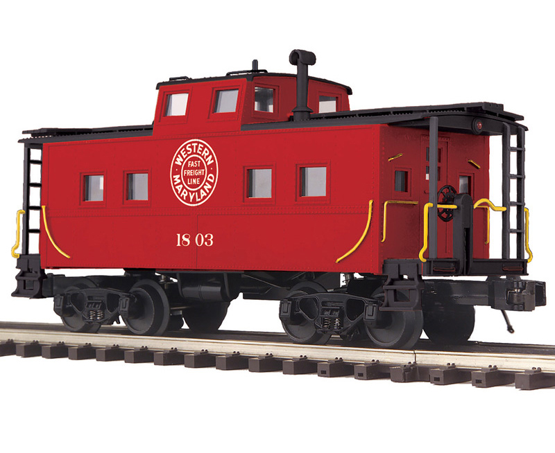 Color photo of O gauge caboose painted red and black with white graphics.