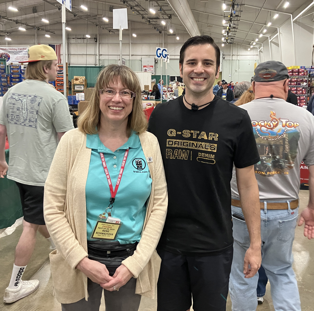 a man and woman standing togethe