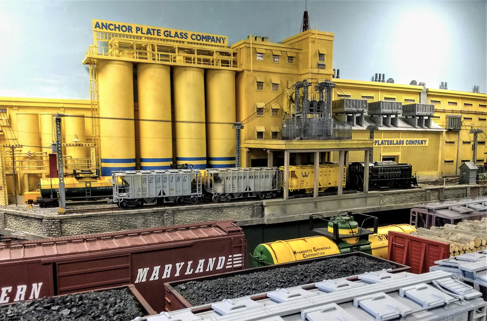 large model yellow structure on garden railway