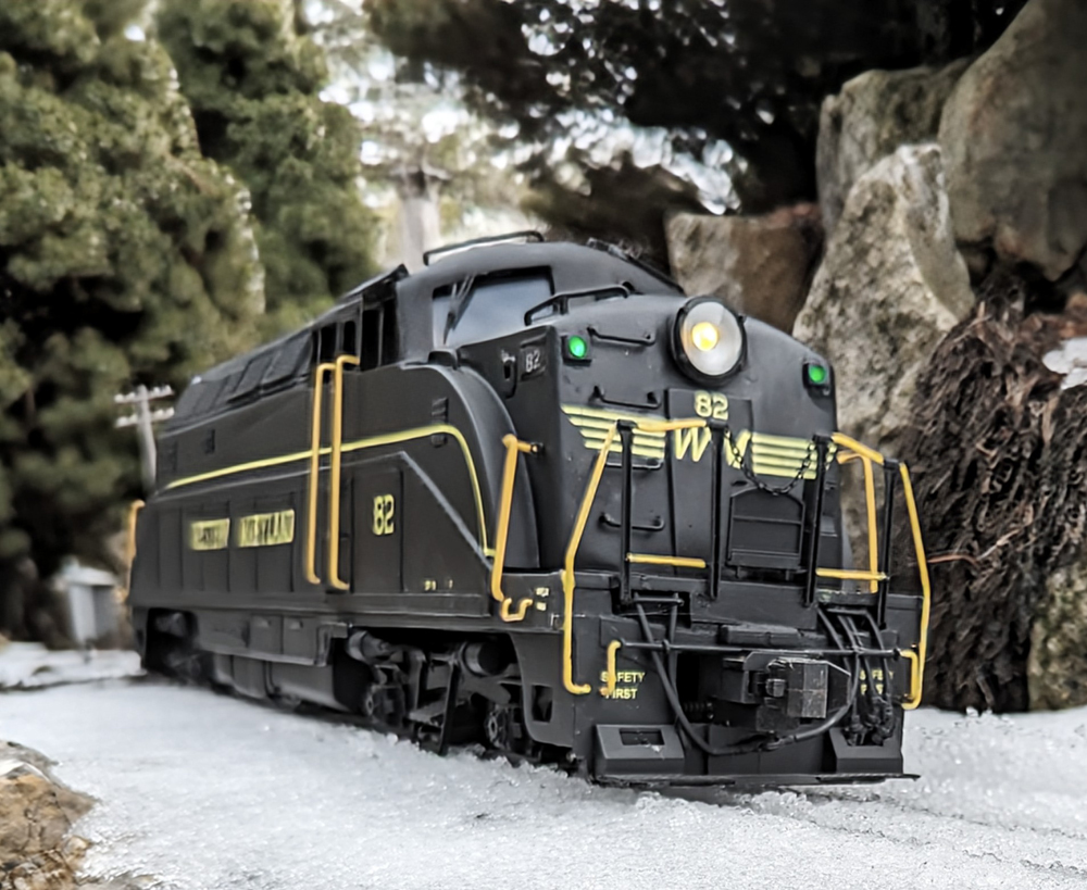 close up of model train with snow on the ground