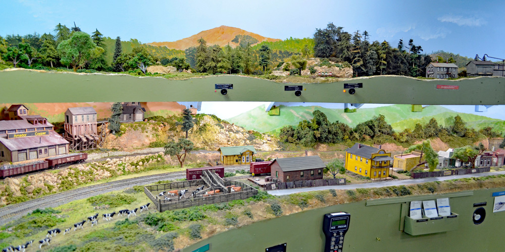 Two levels of a model railroad seen above each other